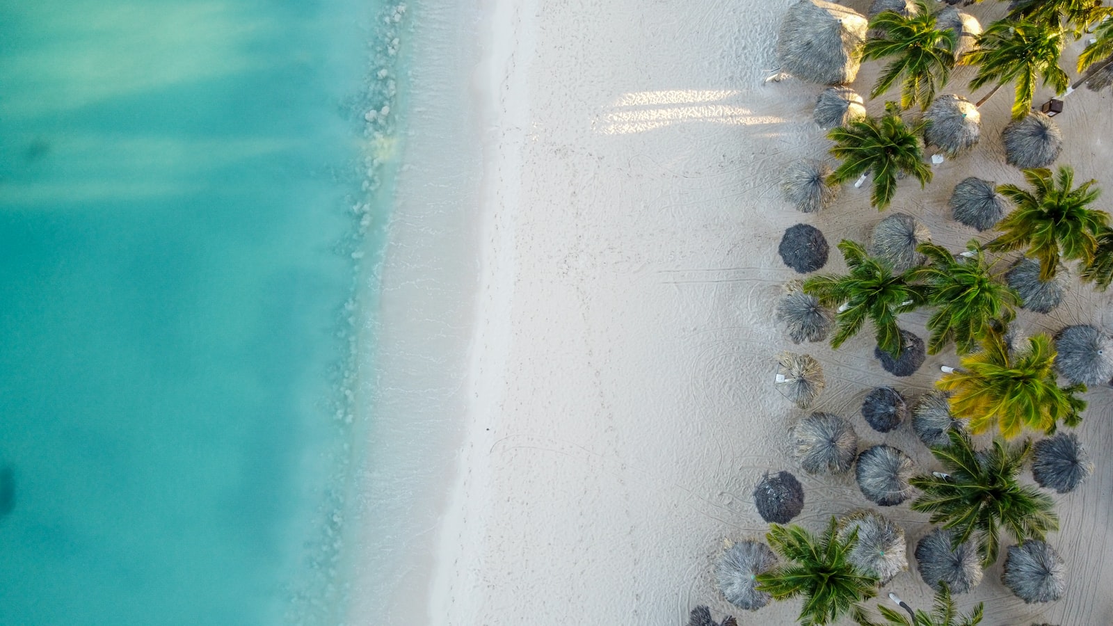 Aerial view of ABC Islands showing turquoise Caribbean waters and colorful coastlines