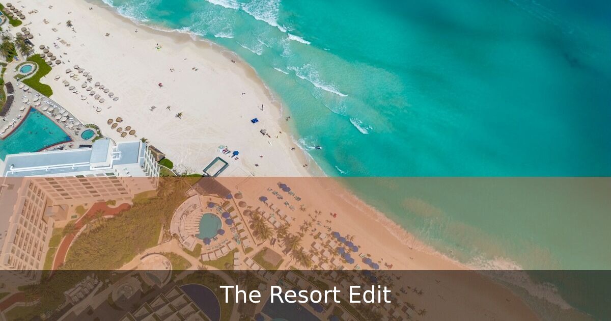 Aerial view of a value-priced Caribbean beachfront resort with large pool, palm trees, turquoise ocean, and white sand