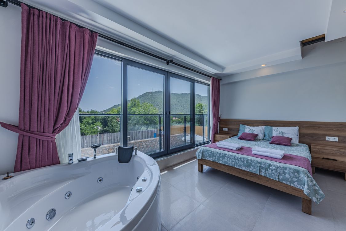 Luxurious hotel suite with private jacuzzi overlooking the ocean