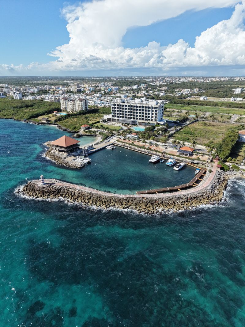 Punta Cana resort aerial with pool complexes and lush tropical gardens facing the ocean