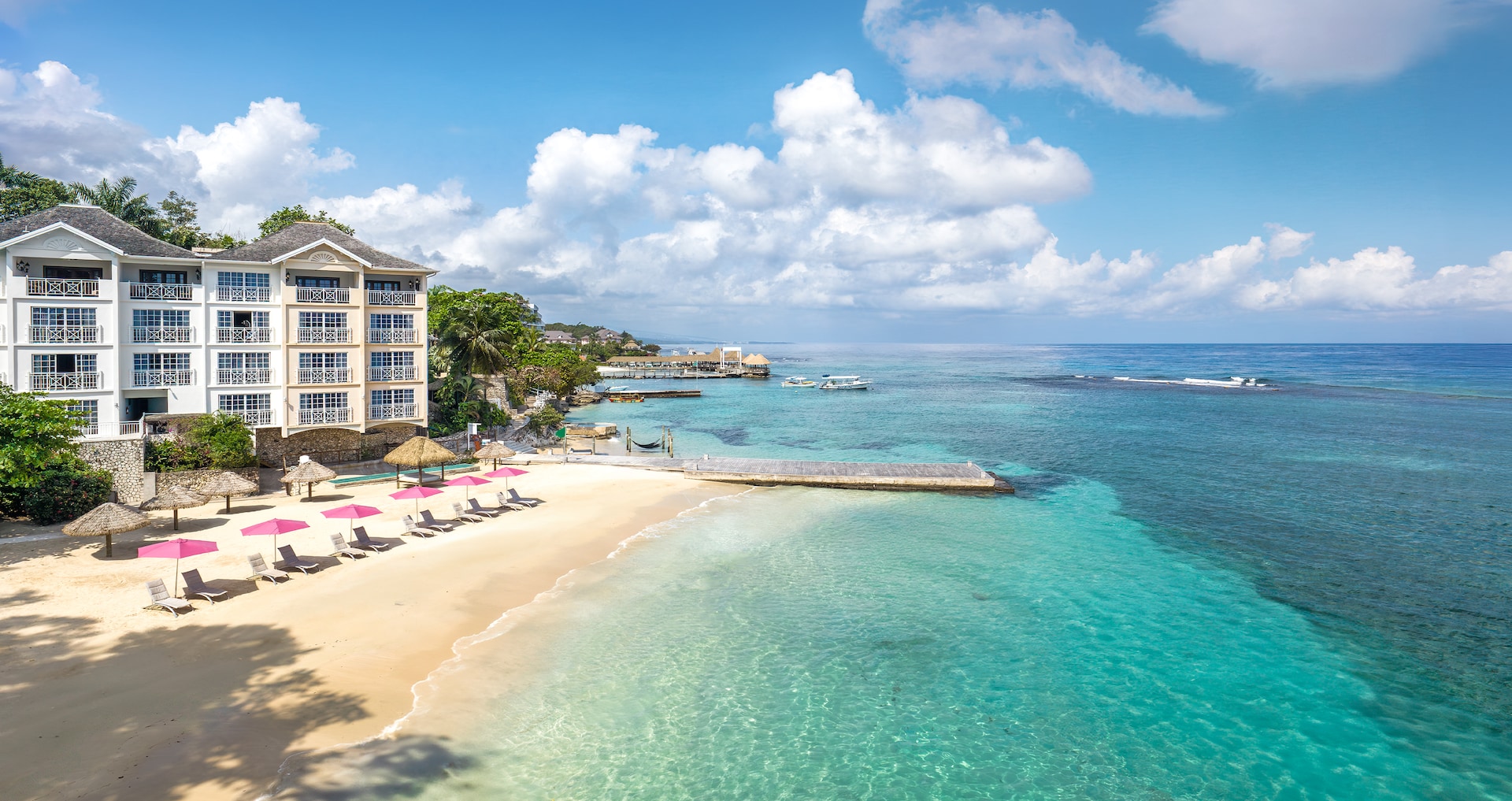 The elegant oceanfront suite at Sandals Royal Plantation, showing the intimate 74-suite scale and direct water access