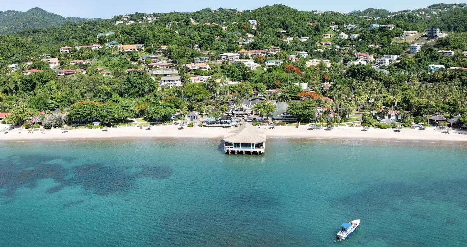 Aerial view of a tropical beach ceremony location.
