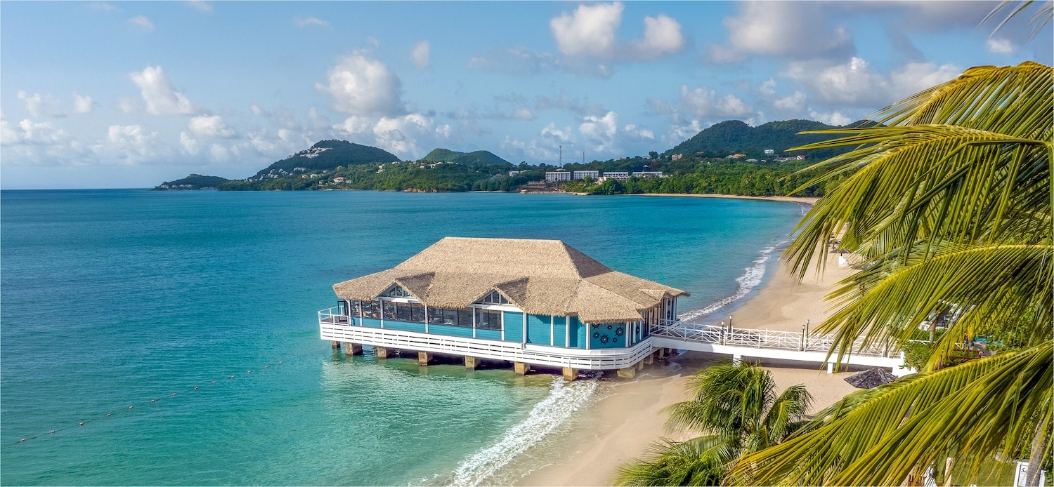 Sandals Halcyon Beach branded image used for calm resort-planning comparison.
