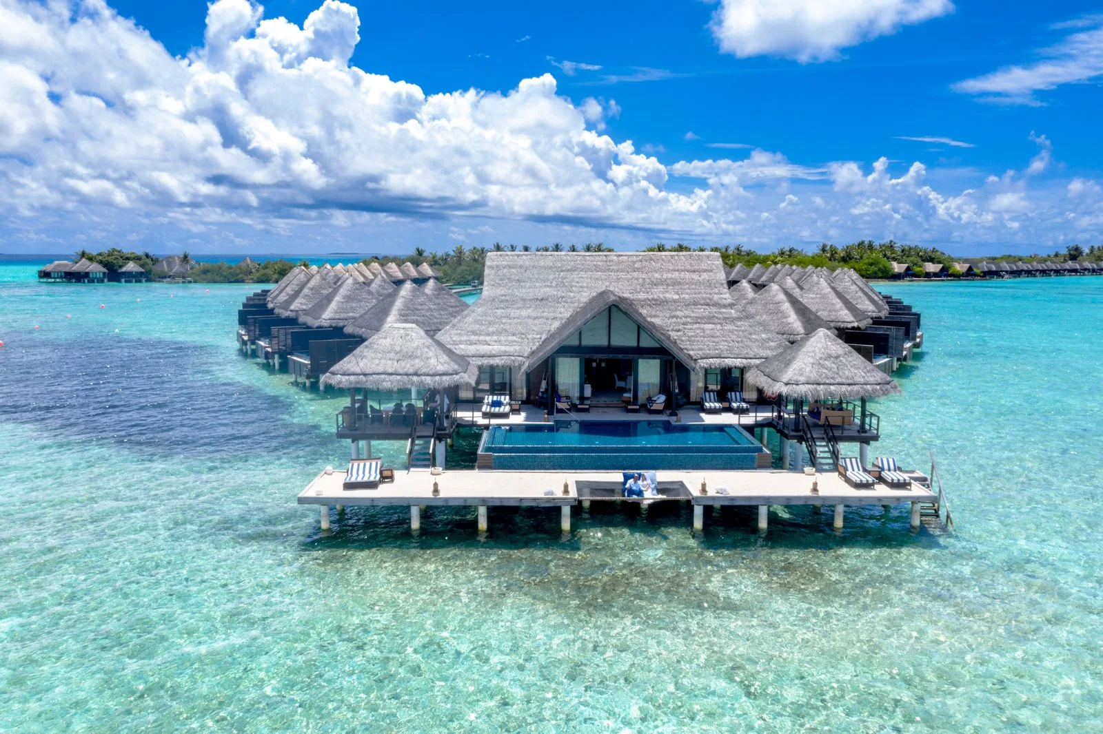 Couple planning their Caribbean vacation budget.