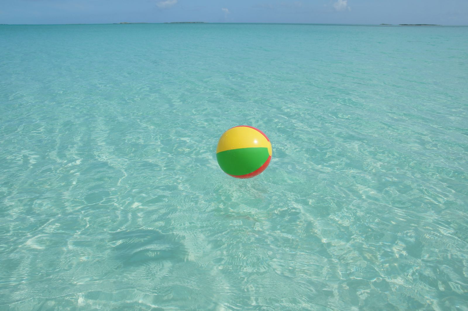 Pristine white sand beach with turquoise waters in The Bahamas