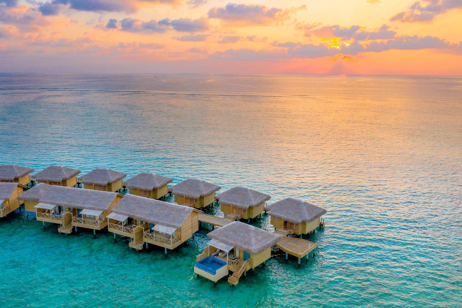 Overwater bungalow with private plunge pool.
